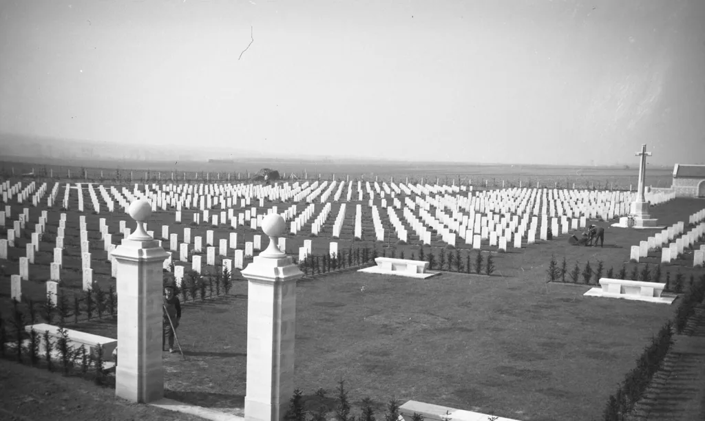 beny sur mer canadian war cemetery reviers calvados france general view from entrance with entrance posts in foreground and cross of sacrifice credit cwgc